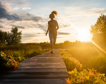 person jogging on a boardwalk